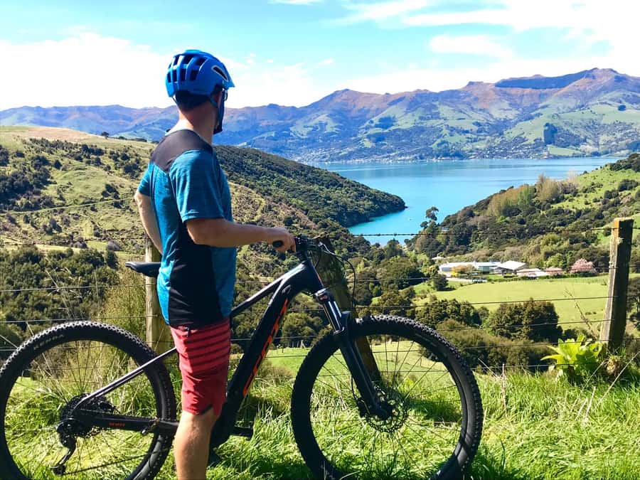 Akaroa: Electric Mountain Bike and Sea Kayak Adventure - Riding to the Crater Summit on an Electric Mountain Bike