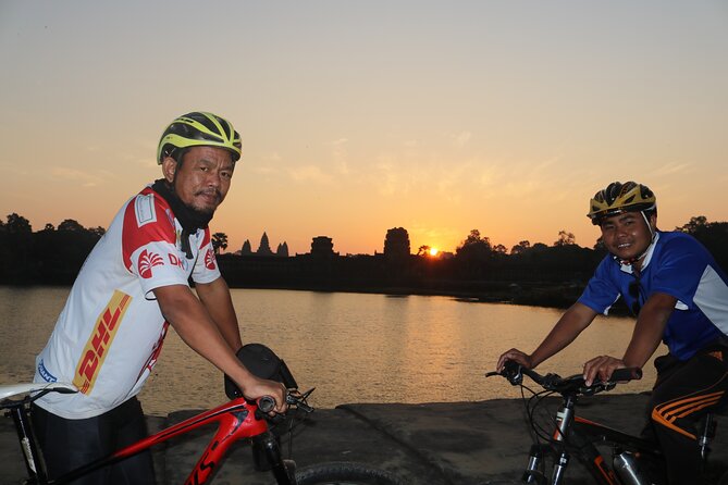 Angkor Sunrise Expedition Cycling Through Serene Backroads - Bayon faces and the end-of-day momentum
