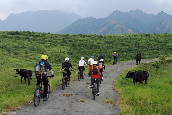 Private E-MTB guided cycling around Mt. Aso volcano & grasslands - The ride up: from Aso Station to the Nakadake crater views