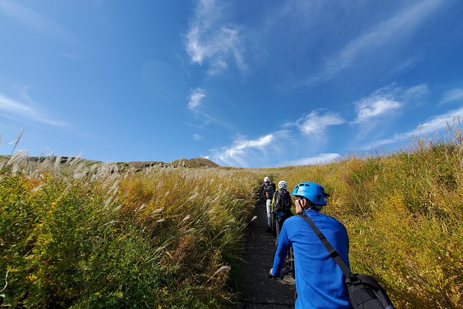 Private E-MTB guided cycling around Mt. Aso volcano & grasslands - Hot spring option after the ride