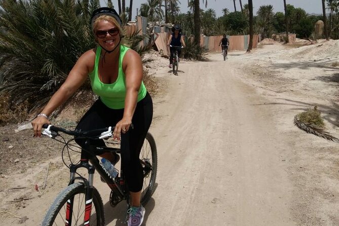 The Palmery Off-Road Bike Tour from Marrakech - Camels, goats, birds, and Atlas views along the tracks