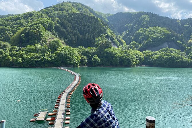 Tokyo's hidden nature cycling tour - Okutama Historical Road Tour - Mugiyama Floating Bridge: the calm mid-lake moment